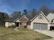 Charming single-Gathering home featuring a well-manicured lawn and an attached two-car garage at 4206 Shoreside Cir, Snellville, GA 30039