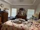 Comfortable primary bedroom features tray ceiling, lots of light, and space for large bedroom furniture at 4206 Shoreside Cir, Snellville, GA 30039