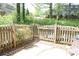 Spacious backyard with a wooden fence and a view of the surrounding greenery at 574 Trillum Sw Ct, Marietta, GA 30008