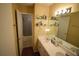 Bright bathroom featuring double sinks, ample counter space, and a separate tub/shower at 574 Trillum Sw Ct, Marietta, GA 30008