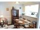 Inviting dining area with a table set for four, complemented by a view into the kitchen at 574 Trillum Sw Ct, Marietta, GA 30008