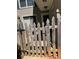 Charming front gate featuring a weathered picket design and the house number '574' at 574 Trillum Sw Ct, Marietta, GA 30008