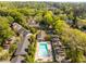 Aerial view of the community with a pool, mature trees and meticulously manicured landscaping at 6700 Roswell Rd # 19F, Atlanta, GA 30328