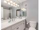 Bathroom with white countertops, neutral paint and a large mirror at 6700 Roswell Rd # 19F, Atlanta, GA 30328