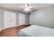Bedroom features hardwood floors, a ceiling fan and double door closets at 6700 Roswell Rd # 19F, Atlanta, GA 30328