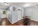 Bright dining area featuring hardwood floors and neutral walls, adjacent to the kitchen and living spaces at 6700 Roswell Rd # 19F, Atlanta, GA 30328