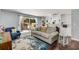 Cozy living room featuring built-in bookshelves, a sliding glass door, and comfortable seating, perfect for relaxing at 6700 Roswell Rd # 19F, Atlanta, GA 30328