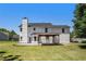 Expansive backyard with a covered patio, lush lawn, and ample space for outdoor activities at 1076 Field View Dr, Mcdonough, GA 30253