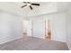 Bedroom featuring neutral carpet, a ceiling fan, and an ensuite bathroom at 1076 Field View Dr, Mcdonough, GA 30253