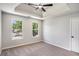 Bedroom featuring neutral carpet, a ceiling fan, and two windows at 1076 Field View Dr, Mcdonough, GA 30253