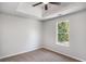 Bedroom featuring neutral carpet and a window with a green view at 1076 Field View Dr, Mcdonough, GA 30253