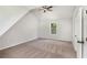 Bedroom featuring neutral carpet and a sloped ceiling at 1076 Field View Dr, Mcdonough, GA 30253