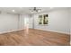 Unfurnished basement features wood-style flooring, recessed lighting, and a large window for natural light at 1315 Woodland Trce, Cumming, GA 30041