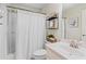 Bathroom featuring a shower-tub combination and a white sink at 1315 Woodland Trce, Cumming, GA 30041