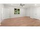 Bedroom featuring wood-style flooring, recessed lighting, and several closets for storage at 1315 Woodland Trce, Cumming, GA 30041