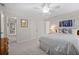 Bedroom with a bed, doors to hall and ensuite, closet, and wood dresser at 1315 Woodland Trce, Cumming, GA 30041