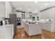 Spacious kitchen with an island, white cabinets and stainless steel appliances at 1315 Woodland Trce, Cumming, GA 30041