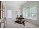 Bright office with a desk, decorative rug, and a bank of arched windows providing ample natural light at 1315 Woodland Trce, Cumming, GA 30041