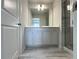 Bathroom with a grey vanity, tiled floors, and a glass enclosed shower at 1608 Falcon Crest Way # 58, Decatur, GA 30032
