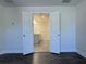 En suite bathroom with double doors, dual sink vanity, and tile flooring at 1608 Falcon Crest Way # 58, Decatur, GA 30032