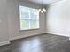 Dining Room with hardwood floors, natural light and a modern chandelier at 1608 Falcon Crest Way # 58, Decatur, GA 30032