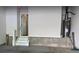 Unfinished garage with water heater and staircase leading to upper level of the home at 1608 Falcon Crest Way # 58, Decatur, GA 30032