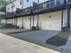 Row of garages below rear decks provides parking and outdoor space for residents at 1608 Falcon Crest Way # 58, Decatur, GA 30032