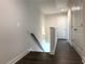 Upstairs hallway with hardwood floors, neutral paint, and natural light at 1608 Falcon Crest Way # 58, Decatur, GA 30032