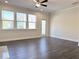 Open-concept living room with hardwood floors, natural light and neutral paint at 1608 Falcon Crest Way # 58, Decatur, GA 30032