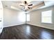 Spacious main bedroom with hardwood floors, tray ceiling and windows at 1608 Falcon Crest Way # 58, Decatur, GA 30032