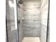 Walk-in shower with marble-look tile and chrome fixtures at 1608 Falcon Crest Way # 58, Decatur, GA 30032