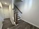 Interior stairway with hardwood flooring and traditional banister at 1608 Falcon Crest Way # 58, Decatur, GA 30032