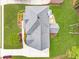 Overhead view of a home with a well-maintained roof, landscaped yard, and concrete driveway at 1611 Threepine Pl, Lilburn, GA 30047