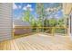 Wooden back deck with black railings, offering an ideal space for outdoor seating and relaxation at 1611 Threepine Pl, Lilburn, GA 30047