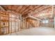 Unfinished basement with exposed ductwork and framing, providing ample space for future development at 1611 Threepine Pl, Lilburn, GA 30047