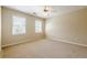 Bedroom with two large windows letting in natural light and a ceiling fan with lights at 1611 Threepine Pl, Lilburn, GA 30047