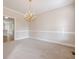 Dining room with chandelier and hardwood floors at 1611 Threepine Pl, Lilburn, GA 30047