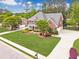 Charming two-story brick home featuring a well-manicured lawn and inviting curb appeal at 1611 Threepine Pl, Lilburn, GA 30047