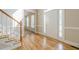 Bright foyer featuring gleaming hardwood floors, staircase, and white trim throughout, creating a welcoming entrance at 1611 Threepine Pl, Lilburn, GA 30047