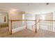 Bright hallway with wood and white banister and views to other rooms at 1611 Threepine Pl, Lilburn, GA 30047