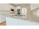 Kitchen island with granite countertop and stainless steel sink at 1611 Threepine Pl, Lilburn, GA 30047