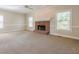Bright living room features a fireplace, large windows and neutral carpeting at 1611 Threepine Pl, Lilburn, GA 30047