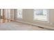 Bright living room with carpet and lots of natural light at 1611 Threepine Pl, Lilburn, GA 30047