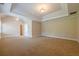 Large carpeted main bedroom with tray ceiling and ample natural light at 1611 Threepine Pl, Lilburn, GA 30047