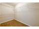 Walk-in closet with wire shelving and carpeted floor at 1611 Threepine Pl, Lilburn, GA 30047