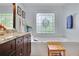 Bathroom features a stained glass window above a soaking tub and a granite vanity at 2473 Kings Arms Dr, Atlanta, GA 30345