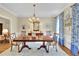 Spacious dining room with hardwood floors, a decorative rug, and ample seating at 2473 Kings Arms Dr, Atlanta, GA 30345