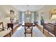 Elegant dining room with hardwood floors, a chandelier, and blue accents at 2473 Kings Arms Dr, Atlanta, GA 30345