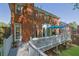 Exterior view of a brick home with a spacious wooden deck, perfect for outdoor dining and entertaining at 2473 Kings Arms Dr, Atlanta, GA 30345