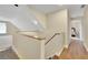 Hallway shows beautiful hardwood floors, wood trim, and access to additional bedrooms at 2473 Kings Arms Dr, Atlanta, GA 30345